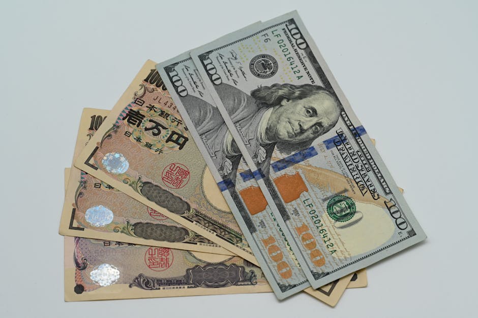 通貨交換の概念を表す米ドル紙幣と日本円紙幣のクローズアップ画像。